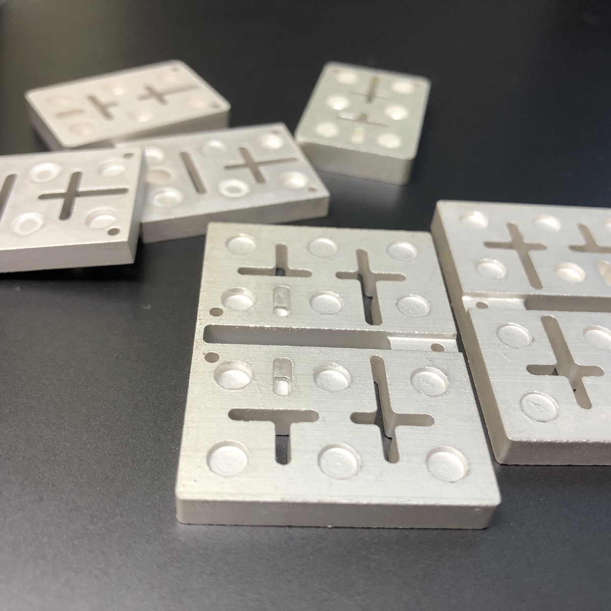 Ceramic waveguide filter components on dark surface
